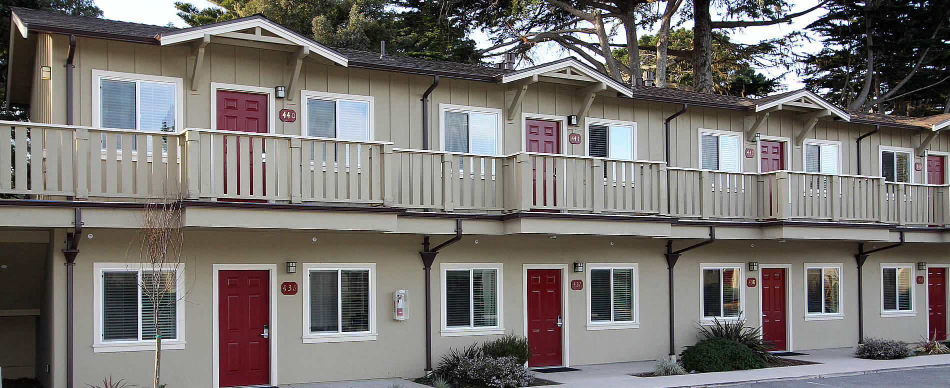 Pacific Grove Hotel - exterior with burgundy doors